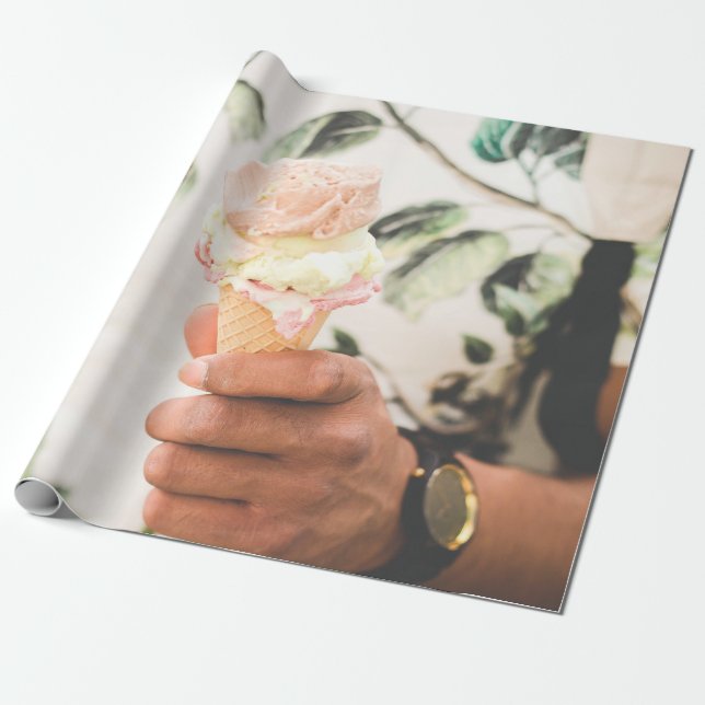 Person holding ice cream cone with three flavours  wrapping paper (Unrolled)