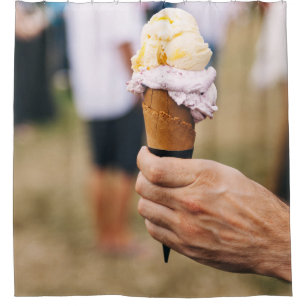 Person holding ice cream on cone