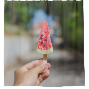 Person holding popsicle in the morning