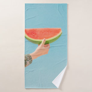 Person holding sliced watermelon bath towel