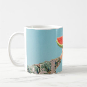 Person holding sliced watermelon coffee mug