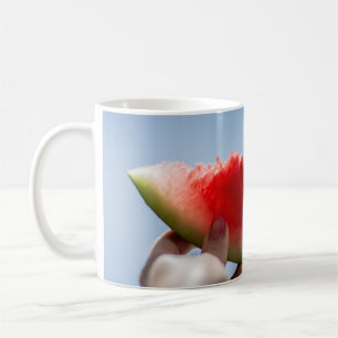 Person holding sliced watermelon coffee mug