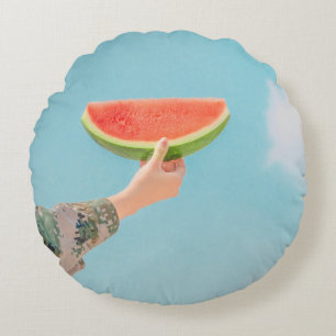 Person holding sliced watermelon round pillow