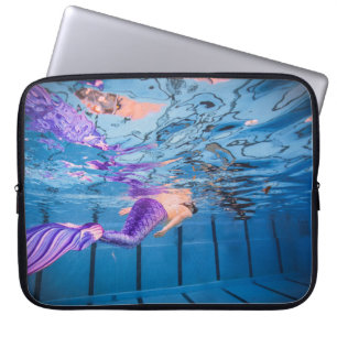 Person in purple pants lying on blue hammock laptop sleeve