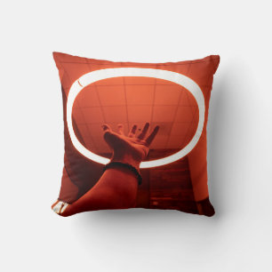 PERSON REACHING ROUND TURNED-ON FLUORESCENT LAMP I THROW PILLOW