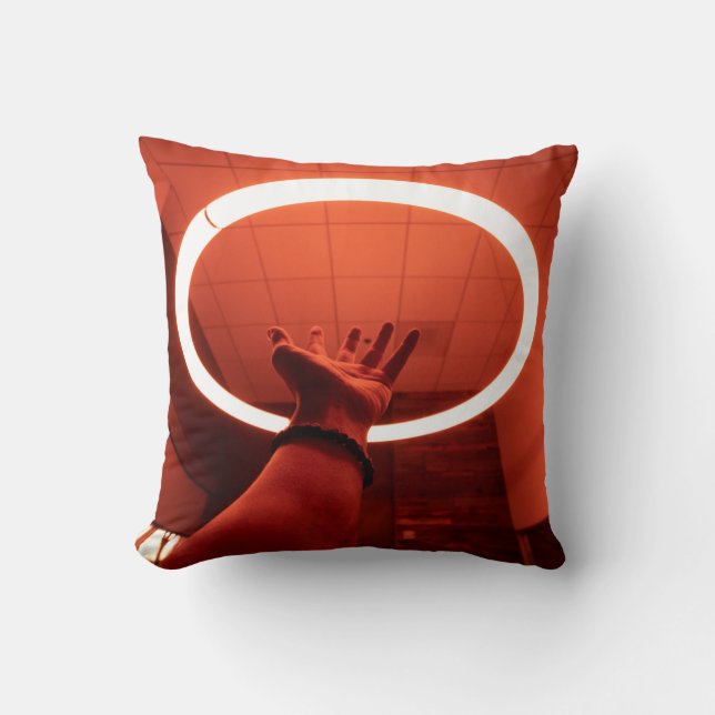PERSON REACHING ROUND TURNED-ON FLUORESCENT LAMP I THROW PILLOW (Front)