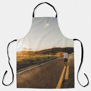 Person running in road in the morning apron