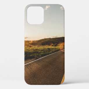 Person running in road in the morning iPhone 12 case