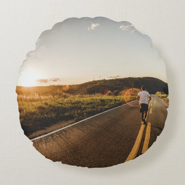 Person running in road in the morning round pillow (Front)