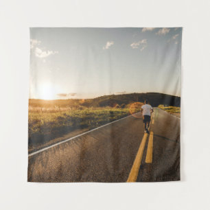 Person running in road in the morning tapestry