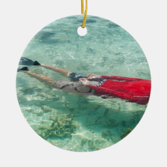 Person snorkelling in clear water ceramic ornament (Front)