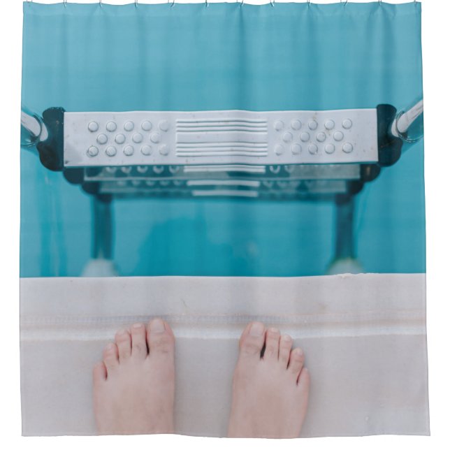 Person standing on swimming pool ladder (Front)