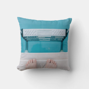 Person standing on swimming pool ladder throw pillow