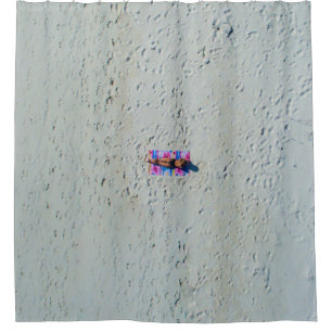 Person sunbathing at the beach