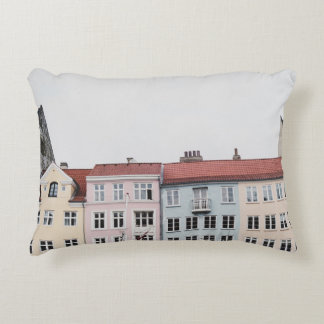 PERSON TAKING PICTURE OF STRUCTURES ACCENT PILLOW