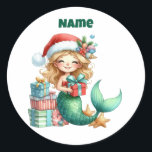Personalised Christmas Mermaid Circular Sticker<br><div class="desc">Make your holiday season magical with this personalised Christmas mermaid sticker! Featuring a charming mermaid design in a circular style, this sticker can be customised with your child’s name or a special message. Perfect for decorating presents, notebooks, party favours, or adding a festive touch to any gift. Durable, vibrant, and...</div>