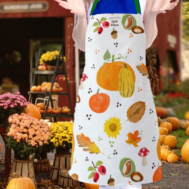 Personalized Autumn Lover Apron (Woman wearing an apron with autumnal pattern in orange, red, green, yellow and brown on white back)