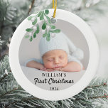 Personalized Baby's First Christmas Foliage Photo Ceramic Ornament<br><div class="desc">This Baby's First Christmas Ornament is decorated with green watercolor mistletoe. Easily customizable with your baby's photo, name, and year. Use the Design Tool to change the text size, style, or colour. Because we create our artwork you won't find this exact image from other designers. Original Watercolor © Michele Davies....</div>