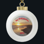 Personalized Beach and Dog at Sunset Ceramic Ball Christmas Ornament<br><div class="desc">This ceramic ball ornament features a California beach with people and a dog splashing in the ocean as the last rays of the sun set. The back has a bell design. With this ornament, you can enjoy a beach sunset anytime. The top of the ocean image has curved text that...</div>