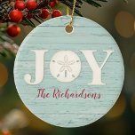 Personalized Beach Sand Dollar Christmas Joy Ceramic Ornament<br><div class="desc">A joyful Christmas ornament with a sand dollar and a weathered wood background for your Christmas Beach decor. Personalize it for yourself,  or for a gift! Designed for you by Blackberry Boulevard.</div>