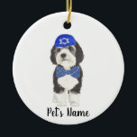 Personalized Bernedoodle Blue Yarmulke Bow Tie Ceramic Ornament<br><div class="desc">I am in love with this beautifully detailed watercolor illustration of a grey, black, and white bernedoodle or sheepadoodle on an ornament with a sweet little blue and white yarmulke and bowtie combo! Personalize these ornaments and make the nice list this year! For the perfect presents, pair it with a...</div>