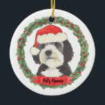 Personalized Bernedoodle Red and Green Santa Hat Ceramic Ornament<br><div class="desc">I am in love with this beautifully detailed watercolor illustration of a grey, black, and white bernedoodle or sheepadoodle on an ornament in a sweet santa hat! Personalize these pastel ornaments and make the nice list this year! For the perfect presents, pair it with a matching item from the collection...</div>