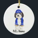Personalized Bernedoodle Yarmulke Hanukkah Blue Ceramic Ornament<br><div class="desc">I am in love with this beautifully detailed watercolor illustration of a grey, black, and white bernedoodle or sheepadoodle on a an ornament with a sweet little blue yarmulke and scarf combo! Personalize these ornaments and make the nice list this year! For the perfect presents, pair it with a matching...</div>