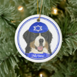 Personalized Bernese Mountain Dog Hanukkah Blue Ceramic Ornament<br><div class="desc">Celebrate your favourite mensch on a bench with personalized ornament! This design features a sweet illustration of a Bernese Mountain Dog with a blue and white yarmulke. For the most thoughtful gifts, pair it with another item from my collection! To see more work and learn about this artist, visit her...</div>