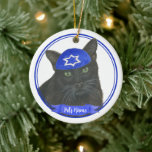 Personalized Black Cat Hanukkah Yarmulke Blue Ceramic Ornament<br><div class="desc">Celebrate your favourite mensch on a bench with personalized ornament! This design features a sweet illustration of a black cat with a blue and white yarmulke. For the most thoughtful gifts, pair it with another item from my collection! To see more work and learn about this artist, visit her at...</div>