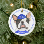 Personalized Black White Pied Frenchie Hanukkah Ceramic Ornament<br><div class="desc">Celebrate your favourite mensch on a bench with a personalized ornament! This design features a sweet illustration of a black and white pied frenchie or french bulldog with a blue and white yarmulke. For the most thoughtful gifts, pair it with another item from my collection! To see more work and...</div>