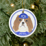Personalized Blenheim Cavalier Hanukkah Yarmulke Ceramic Ornament<br><div class="desc">Celebrate your favourite mensch on a bench with personalized ornament! This design features a sweet illustration of a red and white or blenheim cavalier king charles spaniel dog with a blue and white yarmulke. For the most thoughtful gifts, pair it with another item from my collection! To see more work...</div>