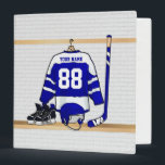 Personalized Blue and White Ice Hockey Jersey Binder<br><div class="desc">A personalized ice hockey jersey in blue and white hanging in a sports locker room with a helmet, ice skates and an ice hockey stick. The jersey can be fully customized with the number and name of your choice to make a great gift for the ice hockey fan, ice hockey...</div>