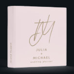 Personalized Blush and Gold Wedding Planner Binder<br><div class="desc">Stay organized and stylish with this personalized blush and gold wedding planner binder. Featuring a unique brush script 2 initial monogram with the couple’s name and "wedding planner" below in stylish font, this chic and romantic binder will keep all your wedding details in one place. The spine text is customizable,...</div>