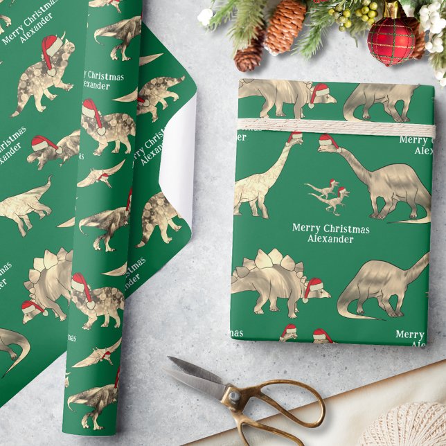Personalized Boys Name Dinosaur Christmas Wrapping Paper (Personalized boys name merry Christmas cute dinosaurs in Santa hats green wrapping paper)