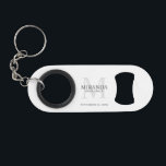 Personalized Bridesmaid's Monogram and Name Keychain Bottle Opener<br><div class="desc">Add a personal touch to your wedding with personalized bridesmaid's monogram and name gift. This design features personalized bridesmaid's name with title and wedding date in grey and monogram in light grey as background, in classic serif font style, on white background. Also perfect for maid of honor, mother of the...</div>