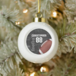 Personalized Chalkboard American Football Ceramic Ball Christmas Ornament<br><div class="desc">A modern American football grid iron design featuring a football on a chalkboard typography background with football terminology in the background. The design features customizable text for the name and number of the football player or grid iron fan. This design has been made in part with graphics licensed by Graphics...</div>