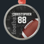 Personalized Chalkboard American Football Metal Ornament<br><div class="desc">A modern American football grid iron design featuring a football on a chalkboard typography background with football terminology in the background. The design features customizable text for the name and number of the football player or grid iron fan. This design has been made in part with graphics licensed by Graphics...</div>