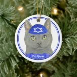 Personalized Chartreux Cat Yarmulke Blue White Ceramic Ornament<br><div class="desc">Celebrate your favourite mensch on a bench with personalized ornament! This design features a sweet illustration of a grey chartreux cat with a blue and white yarmulke. For the most thoughtful gifts, pair it with another item from my collection! To see more work and learn about this artist, visit her...</div>