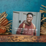 Personalized Class of 2026 Graduate Photo Plaque<br><div class="desc">A modern graduation plaque featuring a full senior portrait with the graduate's name, school, and class year in clean white block typography with thin line accents. The tabletop easel design makes it easy to display at a graduation party or on a shelf at home. Customize with a favourite photo and...</div>