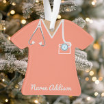 Personalized Coral Nurse Scrubs Ornament<br><div class="desc">Celebrate the incredible nurses in your life with this personalized coral scrubs ornament. Featuring a stethoscope and pen in the pocket,  this ornament is the perfect way to show appreciation for their dedication and hard work. Customize it with their name for a thoughtful and unique gift.</div>