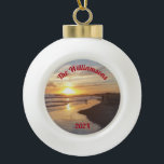 Personalized Dog on Beach at Sunset Ceramic Ball Christmas Ornament<br><div class="desc">This ceramic ball ornament features a California beach with people and a dog splashing in the ocean as the last rays of the sun set. The back has a bell design. With this ornament, you can enjoy a beach sunset anytime. The top of the ocean image has curved text that...</div>