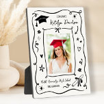 Personalized Doodle Photo Congrats Grad Plaque<br><div class="desc">A charming graduation plaque featuring a senior photo surrounded by a whimsical hand-drawn doodle border with a graduation cap, stars, and confetti on a clean white background. The Congrats headline leads into the graduate's name in script with the school name and class year below. A playful tabletop keepsake for displaying...</div>