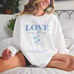 Personalized Dusty Blue Wildflower Bridal Shower Sweatshirt<br><div class="desc">Our Personalized Dusty Blue Wildflower Bridal Shower Crewneck Sweatshirt, designed especially for her bridal party! These sweatshirts are the perfect addition to your bridal shower ensemble, featuring a charming vintage botanical print of wildflowers in a serene dusty blue hue. Ideal for a spring or summer wedding, these sweatshirts capture the...</div>