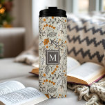 Personalized Fall Foliage Thermal Tumbler<br><div class="desc">Embrace the warmth and beauty of autumn with this personalized tumbler adorned with a charming pattern of fall foliage. The delicate leaves, vibrant berries, and intricate branches create a cozy and inviting scene. Make it truly yours by adding your initial in a stylish monogram. This durable stainless steel tumbler keeps...</div>