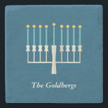 Personalized Family Name Hanukkah Menorah Blue Stone Coaster<br><div class="desc">Celebrate Hanukkah with this elegant personalized stone coaster featuring a beautifully designed menorah on a classic blue background. Perfect for adding a festive touch to your home decor, this coaster makes a thoughtful holiday gift or a stylish addition to your Hanukkah table setting. Customize with a family name for a...</div>