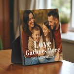 Personalized Family Photo Love Gathers Here Plaque<br><div class="desc">Celebrate the heart of your home with this personalized photo plaque,  featuring your favourite family moment and custom last name. A warm and meaningful accent for shelves,  desks,  or mantels — perfect for holidays,  housewarmings,  or everyday reminders of togetherness.</div>