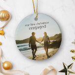 Personalized First Christmas Engaged Couple Photo  Ceramic Ornament<br><div class="desc">Celebrate your first Christmas as an engaged couple with this personalized ceramic ornament, featuring your favourite photo. This unique keepsake is perfect for commemorating your special moment, adding a meaningful touch to your holiday decor. The elegant design, combined with your personal photo, makes it a memorable addition to your tree...</div>