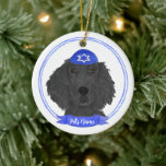 Personalized Flat Coated Retriever Dog Hanukkah Ceramic Ornament<br><div class="desc">Celebrate your favourite mensch on a bench with a personalized ornament! This design features a sweet illustration of a black flat coated retriever dog with a blue and white yarmulke. For the most thoughtful gifts, pair it with another item from my collection! To see more work and learn about this...</div>