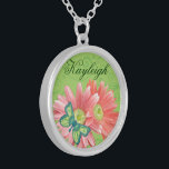 Personalized Gerber Daisy Silver Plated Necklace<br><div class="desc">Beautiful necklace with a modern green background with swirls,  pale coral orange Gerber Daisies and a pretty patterned blue green butterfly with space above the flowers to personalize with the name of your choice. Great gift for Mother's Day,  birthday,  for your bridal party and more!</div>