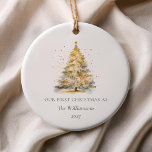 Personalized Gold Christmas Tree Our First Married Ceramic Ornament<br><div class="desc">Commemorate your first Christmas as a married couple with this elegant gold Christmas tree ornament. The minimalist design features a shimmering gold tree, perfect for adding a touch of sophistication to your holiday decor. Personalize it with your names and the year for a beautiful keepsake that will bring festive memories...</div>